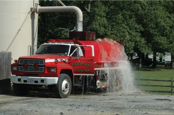  ?? (Photo by Brad Robertson, SDN) ?? After successful­ly completing a water shuttle test last week, the Oktibbeha County Fire Department announced the Bell School House District officially improved its fire safety rating from a nine to an eight, as certified by the Mississipp­i State Rating Bureau.