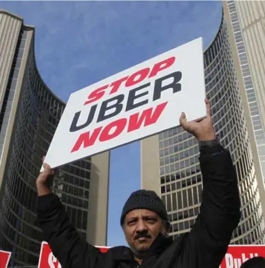  ?? CHRIS HELGREN/REUTERS ?? A taxi driver protests in front of city hall against the Uber ride-booking car service in Toronto on Wednesday.