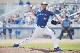  ?? GETTY IMAGES FILE PHOTO ?? John Axford looks to be in fine form at spring training and should be in the Blue Jays bullpen this season when they start the season Thursday at home against the New York Yankees.