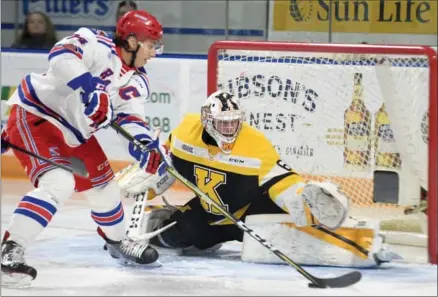  ?? DAVID BEBEE, RECORD STAFF ?? Kitchener Rangers forward Connor Bunnaman heads to the net as Kingston Frontenacs goalkeeper Jeremy Helvig prepares to make a save during the first period Sunday. The Rangers won the contest and now begin a 10-day Christmas break.