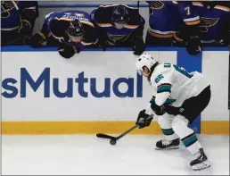  ?? Bay Area News Group/tns ?? St. Louis Blues’ Robert Bortuzzo and St. Louis Blues’ Sammy Blais watch San Jose Sharks’ Erik Karlsson control the puck in the third period in Game 4 of the NHL hockey Stanley Cup Western Conference finals at the Enterprise Center in St. Louis on Friday.