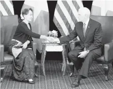  ??  ?? US Vice President Mike Pence holds a bilateral meeting with Myanmar State Counselor Aung San Suu Kyi on the sidelines of the 33rd Associatio­n of Southeast Asian Nations (ASEAN) summit in Singapore. AGENCE FRANCE PRESSE