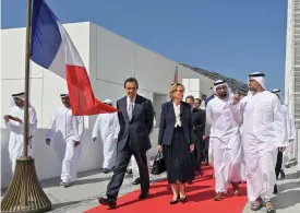  ??  ?? Sheikh Khaled bin Mohammed bin Zayed al Nahyan (second from right) welcomes Claude Chirac during a ceremony marking the second anniversar­y of Louvre Abu Dhabi on November 11, 2019