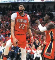  ?? USA TODAY SPORTS ?? New Orleans Pelicans forward Anthony Davis (left) is pumped after dunking against the Portland Trail Blazers.