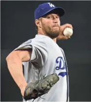  ?? JOE CAMPOREALE/USA TODAY SPORTS ?? Dodgers pitcher Clayton Kershaw has five ERA titles and three Cy Young Awards to go with 150 wins.