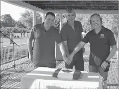  ?? LAWRENCE POWELL ?? West Nova MP Colin Fraser, Nova Scotia Premier Stephen Mcneil, and Annapolis County Warden Timothy Habinski cut the Canada Day cake at Jubilee Park in Bridgetown on July 1.