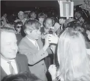  ?? THE ASSOCIATED PRESS FILE ?? Senator Robert F. Kennedy shakes the hands of well wishes who greeted him during his campaign tour of Northern California in San Jose on March 24, 1968.