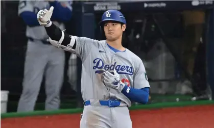  ?? Photograph: Jung Yeon-Je/AFP/Getty Images ?? Shohei Ohtani went 2 for 5 in his regular season debut for the Dodgers.