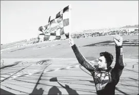  ?? Matt Sullivan Getty Images ?? CHASE ELLIOTT celebrates at Kansas Speedway after his second victory in the last three NASCAR Cup playoff races. He reached the third round.