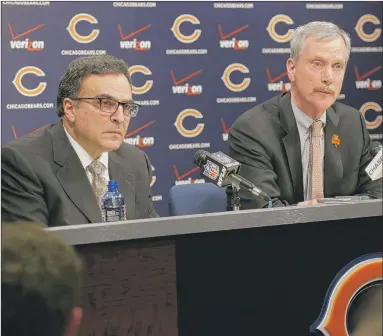  ?? | AP PHOTO ?? Bears President and CEO Ted Phillips (left) and Chairman George H. McCaskey listen to question at a news conference at Halas Hall on Monday.