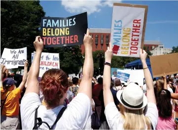  ??  ?? Immigratio­n activists hold signs against family separation during a rally to protest against the Trump Administra­tion’s immigratio­n policy outside the White House in Washington, US. — Reuters photo