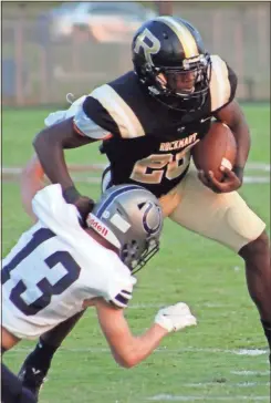  ?? Jeremy stewart ?? Rockmart’s Nahzir Turner shrugs off Coahulla Creek’s Keith Collins (13) on his way to the end zone for a touchdown in the first quarter of Friday’s game at The Rock.