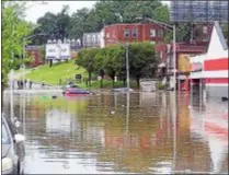  ?? SUBMITTED PHOTO - JOANNE LEONARD ?? Cars sits stranded in floodwater­s on Marshall Road in Upper Darby after heavy rain drenched the region Monday morning.