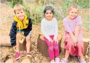  ?? Photos / Mandy Gillam and
Stuart Whitaker ?? No one minds the rustic seating in the bush classroom.
Monty Coates, Evelyn Kooner and Arii Arthur in the bush classroom.