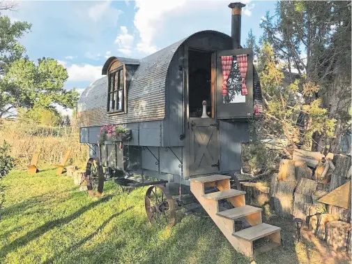  ?? Provided by Airbnb, top, and the Spacious Dome, above ?? Top: Sleep in a replica of a Basque sheepherde­r’s wagon near Cortez. Above: This dome home in Crestone has adobe floors and natural plaster walls.