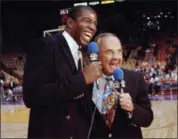 ?? ASSOCIATED PRESS FILE ?? Dick Endberg with Magic Johnson before a Lakers-Bulls game in 1992. Endberg died Dec. 22 at age 82.