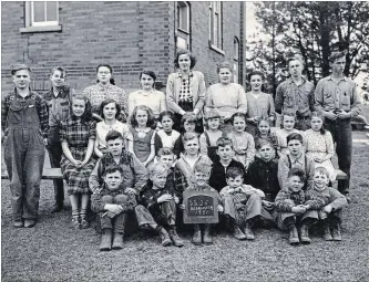  ?? WATERLOO HISTORICAL SOCIETY ?? Not much older than some of her township pupils, Mary Johnston began her teaching career at SS #25 Bearinger school in 1950-51. Please contact Flash from the Past if you know any of the students’ names.