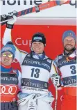 ?? FOTO: DPA ?? Zwischen Weltmeiste­r (Beat Feuz, li.) und Olympiasie­ger (Aksel Lund Svindal, re.): Thomas Dreßen.