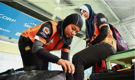  ??  ?? Iron ladies: Rifle shooters Muslifah Zulkifli (left) and Nur Ayuni Farhana Abdul Halim will carry Malaysia’s hope in the Kuala Lumpur SEA Games in August.