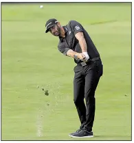  ?? AP/MARK LENNIHAN ?? Dustin Johnson shot a 4-under 67 during Friday’s second round of The Northern Trust at Liberty National in Jersey City, N.J., and holds a one-shot lead over fellow American Jordan Spieth.