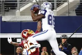  ??  ?? Cowboys receiver Dez Bryant makes a leaping touchdown catch Thursday. | AP