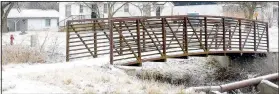  ?? (NWA Democrat-Gazette/Mike Eckels) ?? The pedestrian bridge over the Decatur Branch, next to the Arkansas 59 two-lane bridge in southern Decatur is slated to be moved to Veterans Park by March 1, where it will become part of the new walking trail.