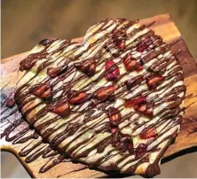  ??  ?? Max Brenner is selling a chocolate pizza to celebrate the month of love.