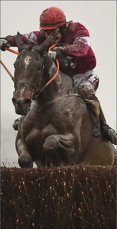  ??  ?? J.J. Slevin and General Principle (left) jump the last fence en route to glory in Fairyhouse on Easter Monday.