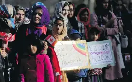  ??  ?? A crowd of thousands awaits the arrival of His Holiness Hazrat Mirza Masroor Ahmad, Caliph of the Ahmadiyya Muslim faith, at the Baitun Nur Mosque on Tuesday.