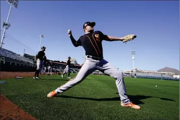  ?? DARRYL WEBB — FOR BAY AREA NEWS GROUP ?? Giants pitcher Logan Webb warms up on the first day Thursday as pitchers and catchers report to Scottsdale Stadium.