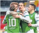  ??  ?? Boyle celebrates with his team-mates after making it 2-0