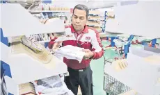  ?? ?? Analysts remain wary over its recovery prospects as the competitio­n in last mile delivery space continue to remain intense, as evident by Nationwide Express' recent announceme­nt to gradually cease operations. — Bernama photo