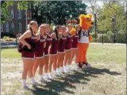  ?? LISA MITCHELL - DIGITAL FIRST MEDIA ?? Kutztown University cheerleade­rs and mascot Avalanche during the signing of the KU Alma Mater.