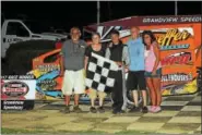  ?? RICK KEPNER - FOR DIGITAL FIRST MEDIA ?? Race winner Dylan Swinehart, center, is pictured with his grandparen­ts, including former track champions Ray Swinehart, second from right, and Dennis Bailey, left, in victory lane Saturday night at Grandview Speedway.