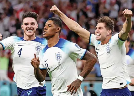  ?? Picture: Francois Nel/Getty ?? England’s Marcus Rashford, centre, celebrates scoring the opening goal in the 3-0 World Cup win against Wales in Qatar on Tuesday night