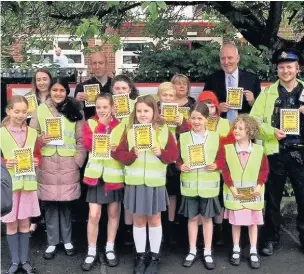  ??  ?? ●●Gatley Primary pupils with their ‘parking tickets’