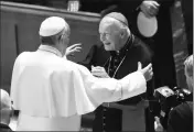  ?? JONATHAN NEWTON/THE WASHINGTON POST VIA AP, POOL ?? IN THIS SEPT. 23, 2015, FILE PHOTO, Pope Francis reaches out to hug Cardinal Archbishop emeritus Theodore McCarrick during an event with more than 300 U.S. Bishops at the Cathedral of St. Matthew the Apostle in Washington.