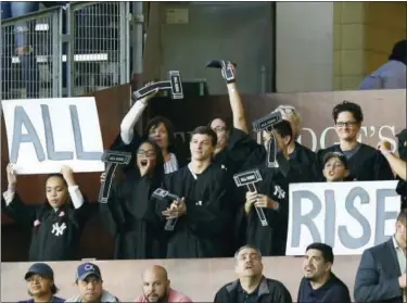  ?? KATHY WILLENS — THE ASSOCIATED PRESS ?? Yankees fans occupy “The Judge’s Chambers” section above right field at Yankee Stadium.