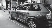  ?? [AP PHOTO] ?? An Uber driverless car is displayed in a garage in San Francisco. Uber suspended all of its self-driving testing this week after what is believed to be the first fatal pedestrian crash involving the vehicles.