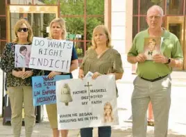  ?? AMY DAVIS/BALTIMORE SUN ?? Mary Corzine, from left, of Silver Spring, Judy Lorenz, of Bowie, Teresa Lancaster, of Edgewater, and David Lorenz, of Bowie, survivors and advocates for abuse victims from the Survivors Network of those Abused by Priests, gather outside the Maryland Attorney General’s Office.