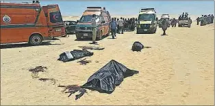  ?? AP PHOTO ?? This image released by the Minya governorat­e media office shows bodies of victims killed when gunmen stormed a bus in Minya, Egypt, Friday. Egyptian officials say dozens of people were killed and wounded in an attack by masked militants on a bus...