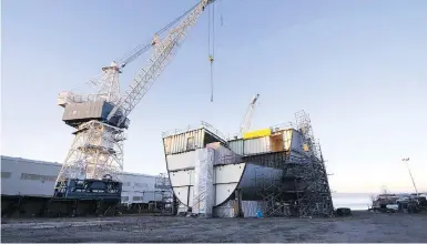  ?? JACQUES BOISSINO / THE CANADIAN PRESS ?? A ship under constructi­on at the Davie shipyard in Levis, Que. The federal government has reached a deal with the Quebec firm for three new icebreaker­s for the coast guard, this first of which is expected to be ready for duty this winter.