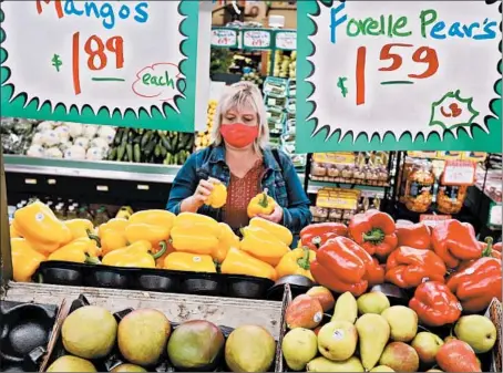  ?? ANTONIO PEREZ/CHICAGO TRIBUNE ?? Eva Rosol shops at Nature’s Best inWestmont last week. Rosol shops the circulars and frequents five different grocery stores to find the lowest prices.