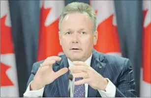  ?? CP PHOTO ?? Bank of Canada Governor Stephen Poloz responds to a question on the banks interest rate cut decision during a news conference in Ottawa Wednesday.