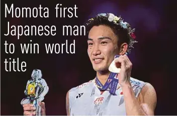  ?? AFP PIC ?? Kento Momota celebrates his triumph in the men’s singles yesterday.