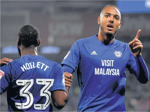 ??  ?? > Kenneth Zohore (right) is close to a first team return for Cardiff City, but club boss Neil Warnock is still interested in signing a striker on loan