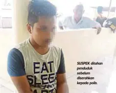  ??  ?? SUSPEK ditahan penduduk sebelum diserahkan kepada polis.