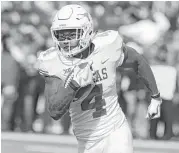  ?? Rod Aydelotte / Associated Press ?? Texas safety DeShon Elliott returns an intercepti­on for a touchdown against Baylor on Oct. 28. Elliott is tied for second nationally with six intercepti­ons.