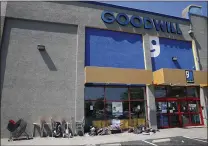  ?? JANE TYSKA — STAFF PHOTOGRAPH­ER ?? Clothes, chairs and other items are left outside a closed Goodwill store on MacArthur Boulevard in Oakland last week.