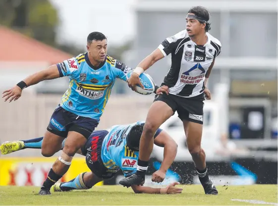  ?? Picture: AAP ?? Seagull Brayden McGrady breaks a tackle in the Intrust Super Cup match between Norths Devils and Tweed Heads.